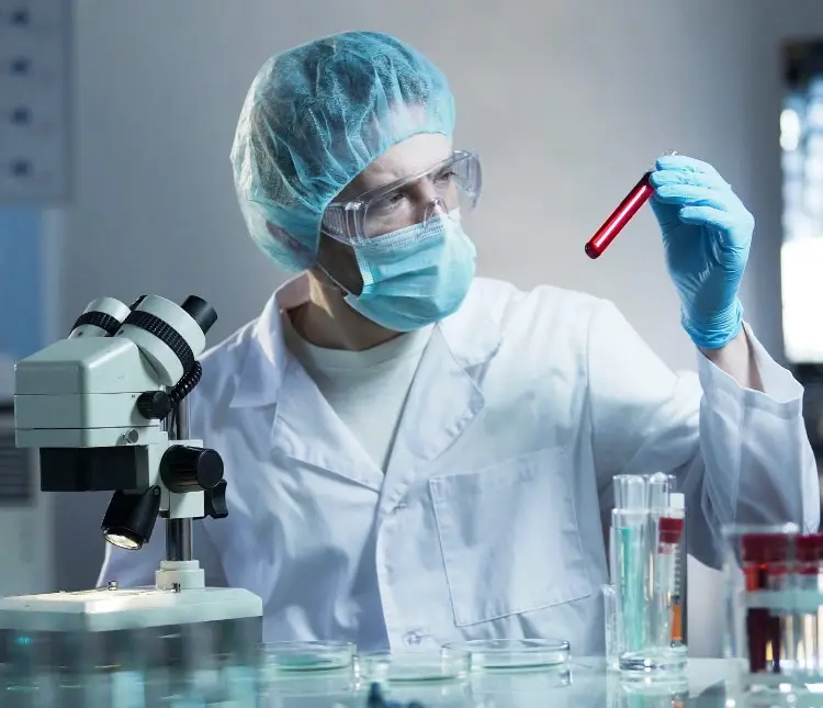 Lab technician with microscope